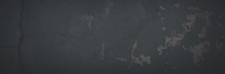 Dark wide panoramic background. Peeling paint on a concrete wall. Faded dark texture of old cracked...