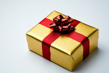 Obraz premium A golden gift box with a red ribbon, white background, high resolution, no shadows, no text, no realistic photo details, high definition, high quality, high detail, high sharpness, high contrast,