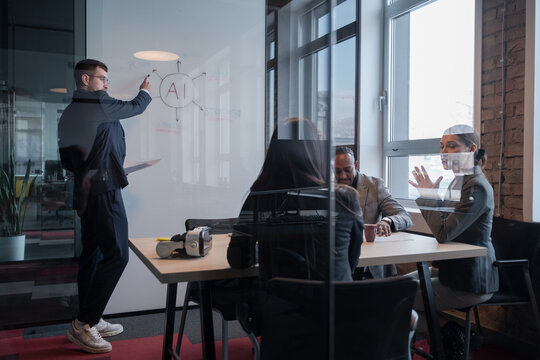 Business team discussing AI technology in a modern office. Concept of artificial intelligence in corporate strategy, innovation, and digital transformation