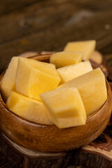 pumpkin pulp in a wooden bowl on the table