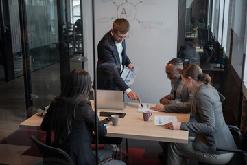 Business team in a modern office discussing data analytics and artificial intelligence. Concept of...