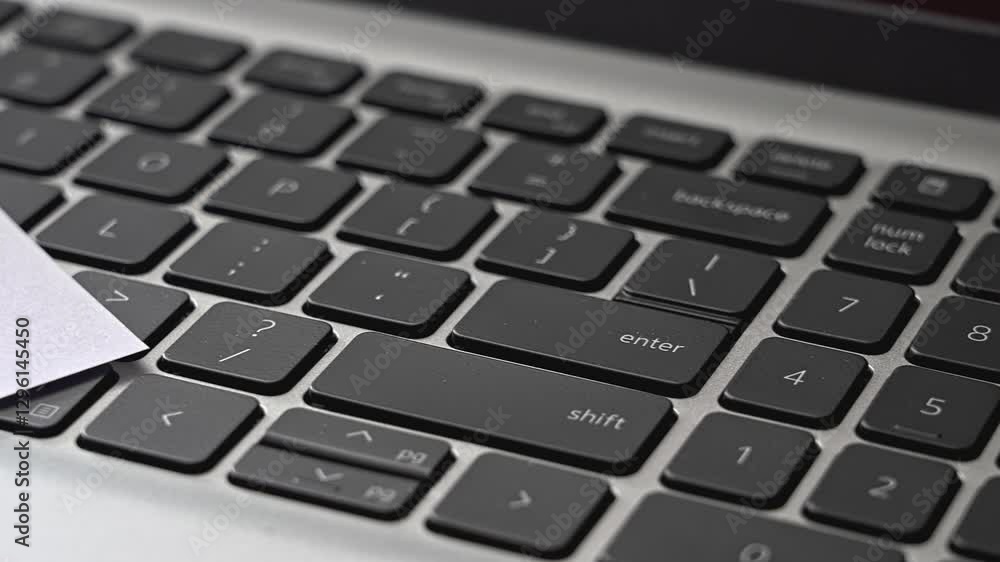 Poster close-up view of a modern laptop keyboard highlighting function keys and numeric keypad arrangement 