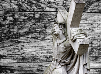 Jesus Christ under the weight of the cross. The suffering and death of God