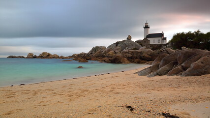 Strong winds hit the shore at Phare de Pontusval Lighthouse built in 1868 at Beg-Pol Point,...