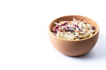 Coleslaw salad in wooden bowl isolated on white background. Copy space