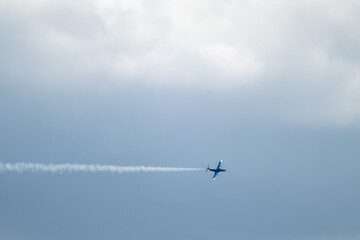 L-29 Jet Plane with Contrails in Clouds