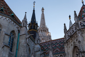 Fototapeta premium Spires of Matthias Church in Budapest, bottom view before sunset