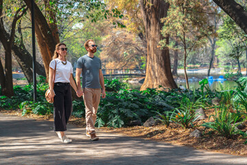 A tourist couple strolling the Chapultepec Forest in Mexico City