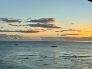 Clear sunset from Waikiki Beach Hawaii with boats in the foreground