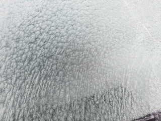 Frost-covered windshield on a chilly morning.