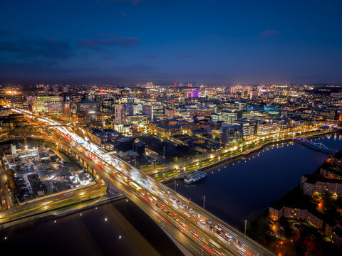 Aerial rush hour traffic M8 motorway highway Glasgow across river Clyde bridge