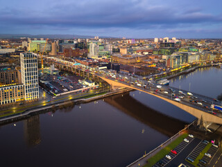 Sunset night aerial city Glasgow Scotland and river Clyde bridge M8 rush hour traffic