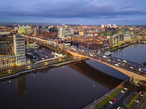Sunset night aerial city Glasgow Scotland and river Clyde bridge M8 rush hour traffic