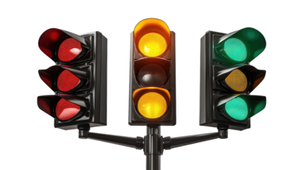 Traffic Signals: A close-up shot of traffic lights showing red, yellow, and green illuminated signals, illustrating the universal language of road safety and control.