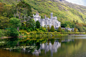 Kylemore Abbey with water reflections in Connemara, County Galway, Ireland, Europe. Benedictine...