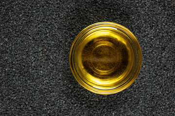Unrefined cold pressed sesame oil in a glass bowl.