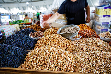 Stand with different nuts and dried fruits s at Chorsu Bazaar, a market in Tashkent, Uzbekistan
