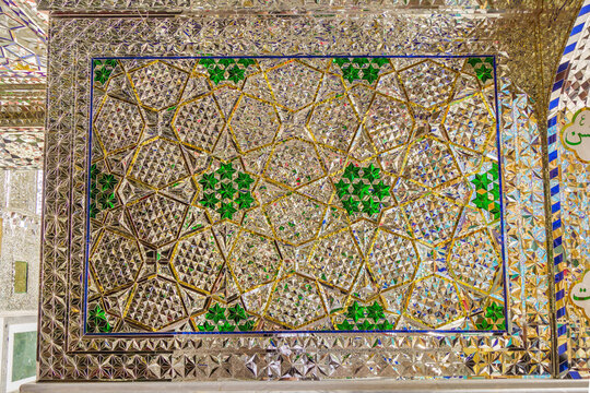 Mirror wall of intricate geometric patterns in the shrine of a Shiite saint or imam. Shot in the shrine of Imamzadeh Mohammed Helal, Aran va Bidgol, Iran - Powered by Adobe