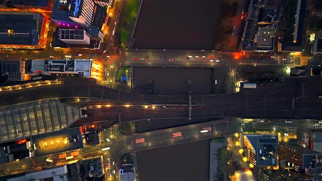 Topdown aerial night train bridge traffic across clyde river