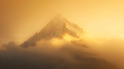 A mountain peak emerges from the clouds in a warm, golden light.