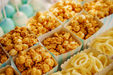 Caramel popcorn cups and chip rings for a festive dessert. A simple and delicious candy bar for a party.