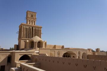 Fototapeta premium The spectacular wind catchers made with adobes in the historical mansion of Aghazadeh in Abarkuh, Yazd, Iran.