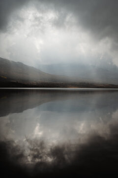 Sun Beams Breaking Through Clouds Over Lake, Jotunheimen