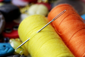 Macro needle and colored threads. Sewing accessories.