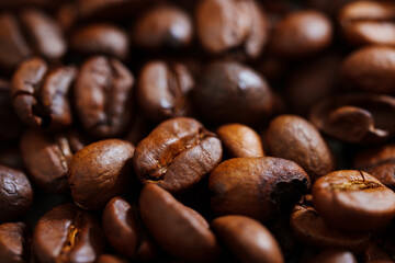 background. roasted beans of natural coffee. raw materials for coffee shops, coffee machines.