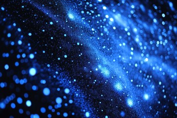 Obraz premium A photo showcasing a blue and black background filled with a multitude of dots Representation of data storage using nanotechnology .