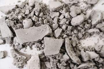 splinters and crumbs from the wrong gypsum or cement product. errors in the manufacture of dishes...