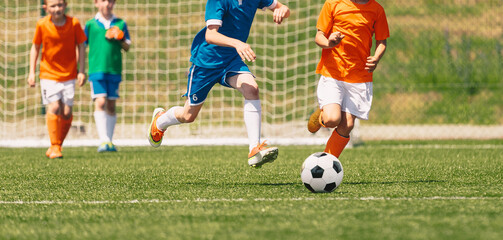 Running Young Soccer Football Players. Youth Soccer Competition Between Two Footballers. Football...