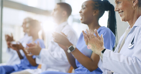 Doctors, happy and applause for celebration in conference with healthcare, presentation or medical results in hospital meeting or workshop. Clapping, group and nurses with smile for goals or news