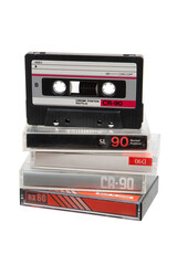 Stack of vintage audio cassettes, black and silver, in clear cases, retro 90s media, nostalgic tech.