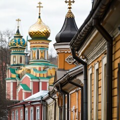 Obraz premium Ornate church domes and historic buildings line a city street, creating a picturesque European scene.