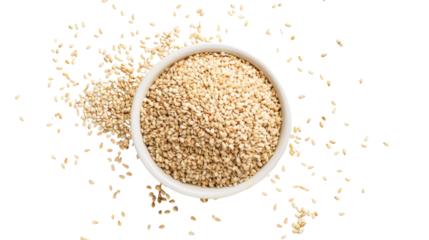 Sesame seeds falling into white bowl on transparent background