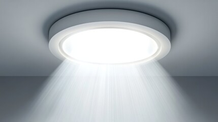 A white round ceiling light fixture with a bright light emitting from the center.