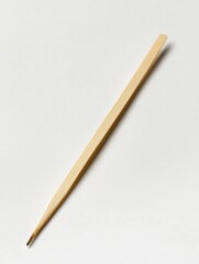 A wooden toothpick is shown on a white background