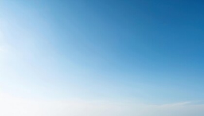 Fototapeta premium serene clear blue sky with soft gradient from deep azure to pale white, minimalistic background for design, nature, or mood
