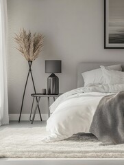 Vase on metal table and grey lamp in spacious bedroom with white carpet and gallery on wall above bed