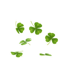 Obraz premium A dynamic collection of fresh four-leaf clovers falling gently through the air captured in mid-motion with soft shadows