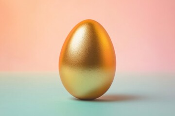 A gold egg sits on a blue surface. The egg is shiny and golden, and it is a symbol of new beginnings or a fresh start