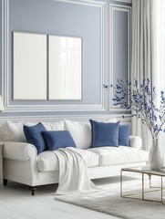 White and blue living room with sofa, armchair, lamp, posters