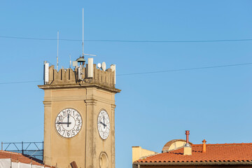 The ancient clock tower in the historic center of Collesalvetti, Livorno, Italy