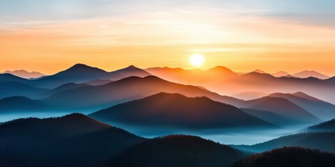 Obraz premium Soft rolling hills covered in morning mist, layers of distant mountains fading into the golden sunrise, peaceful and dreamlike scenery
