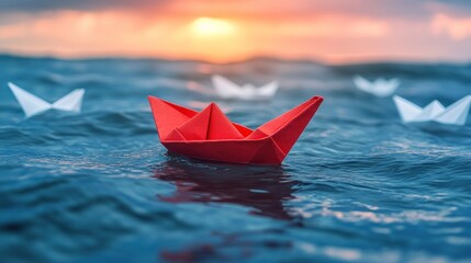 Fototapeta premium Red paper boat leads others at sunset. (1)