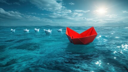 Fototapeta premium Red paper boat leads white boats on blue ocean.