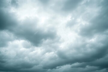 Obraz premium A panoramic view of a dramatic overcast sky filled with numerous dark gray and bluishgray clouds creating a moody atmosphere