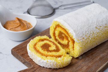 Roll cake or swiss cake filled with dulce de leche