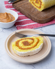 Roll cake or swiss cake filled with dulce de leche